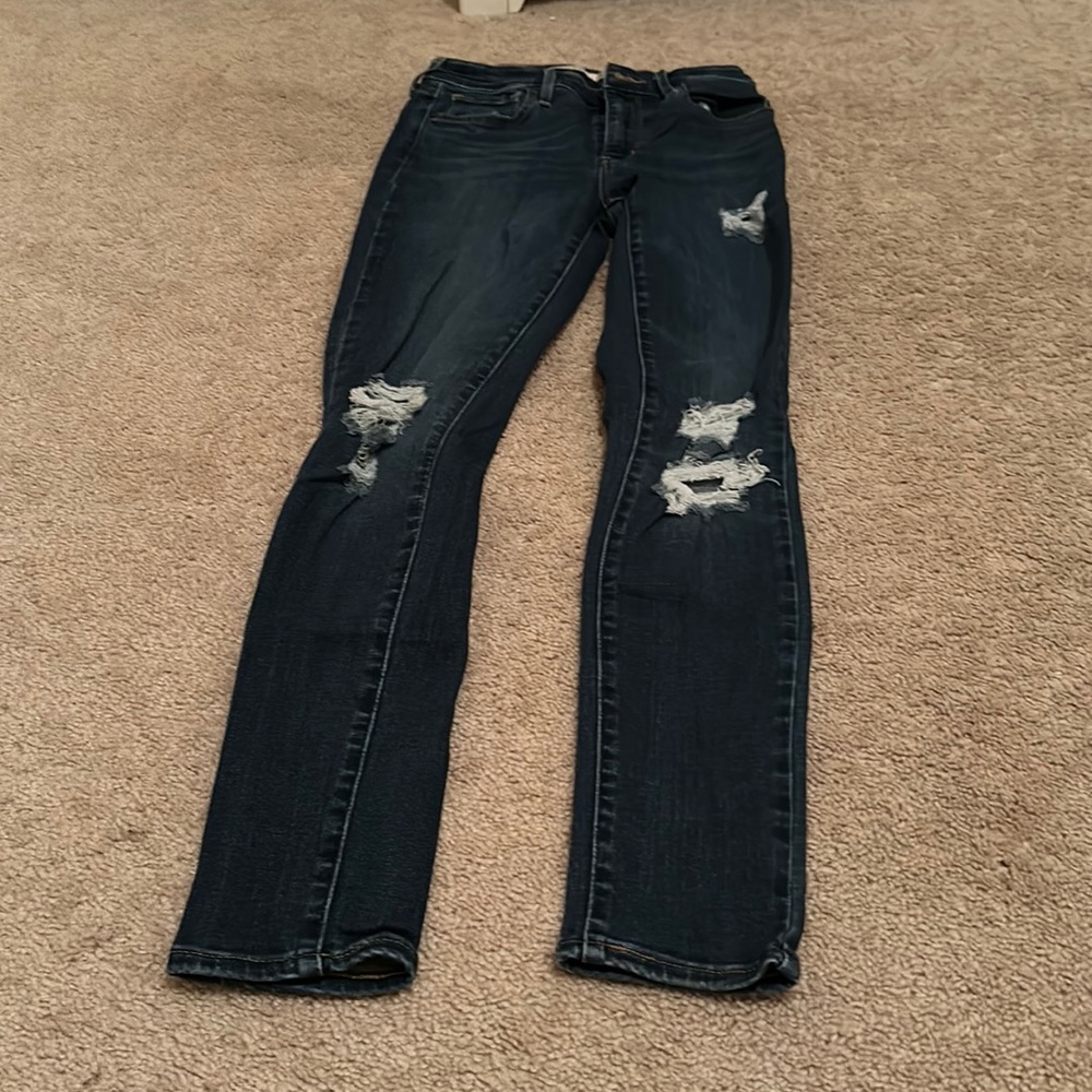 Dark Blue Washed Distressed Levi’s High-Rise Skinny Jeans
